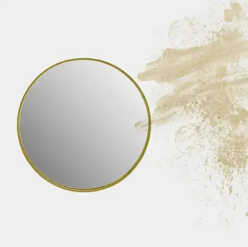 Espejo Circular Eye con estructura metálica y diseño minimalista, presentando pinceladas abstractas en beige sobre un fondo blanco.